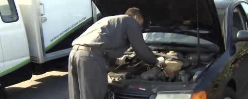 WrenchPatrol mechanic servicing a car